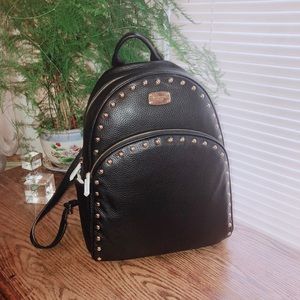 authentic Micheal kors LG black leather backpack